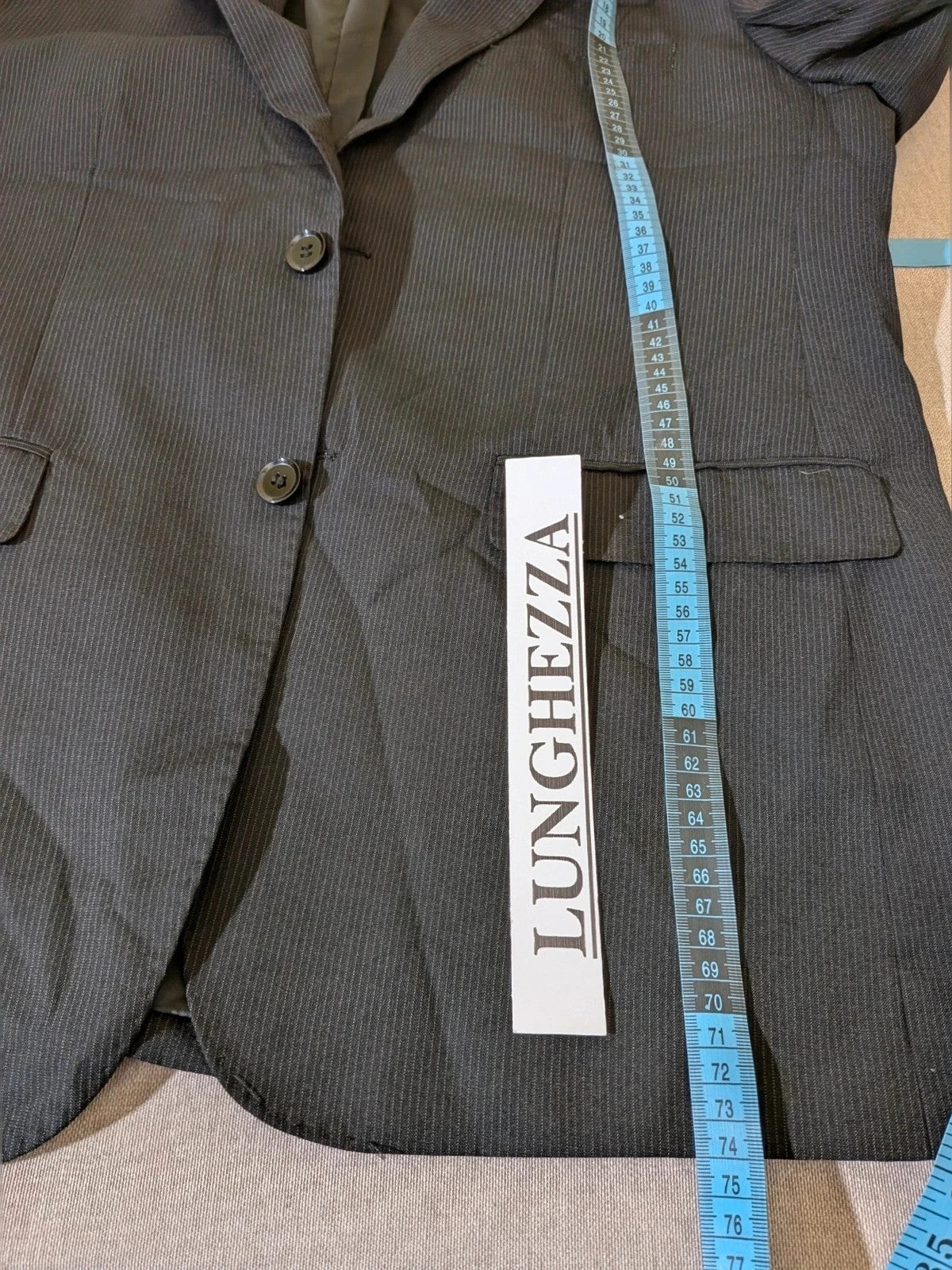 Radaus black suit with modern cut, purple contrast lining, soft viscose blend.
