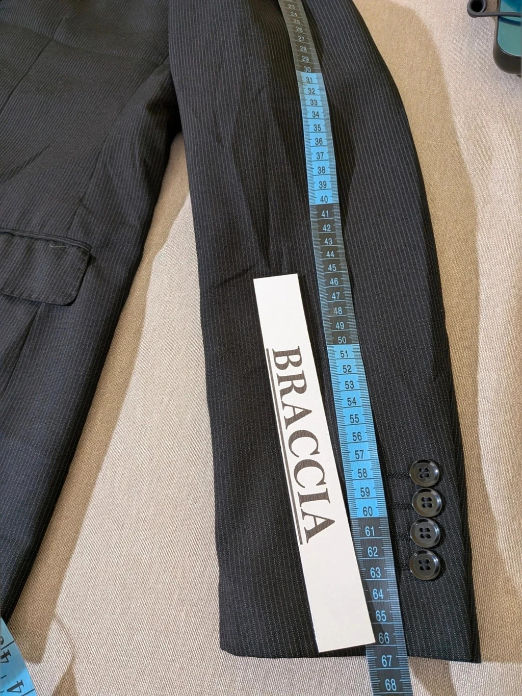 Radaus black suit with modern cut, purple contrast lining, soft viscose blend.