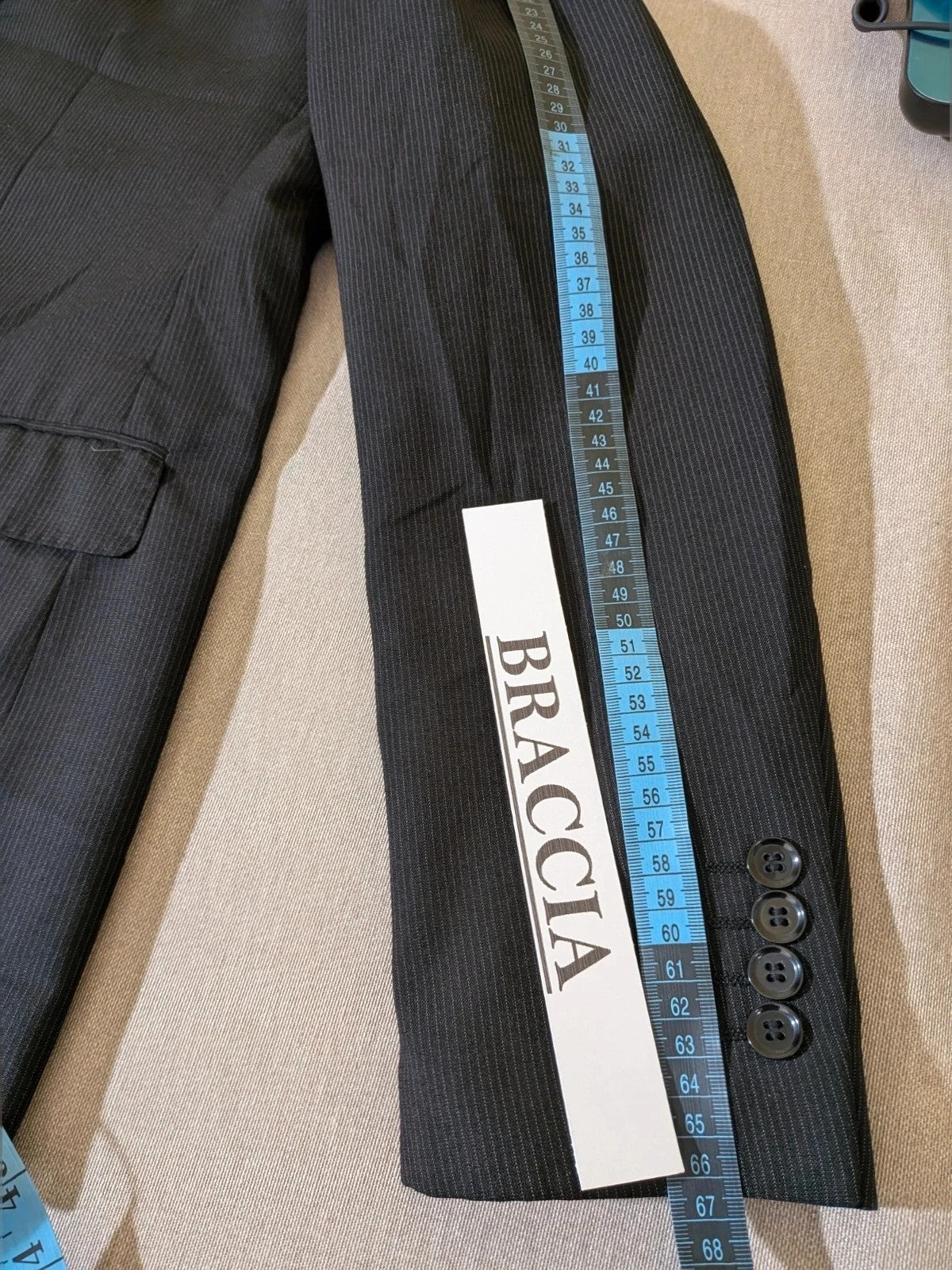 Radaus black suit with modern cut, purple contrast lining, soft viscose blend.