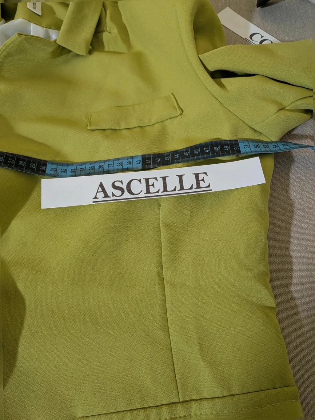 New Collection green suit set with fitted blazer, wide-leg trousers, and classic lapel details.