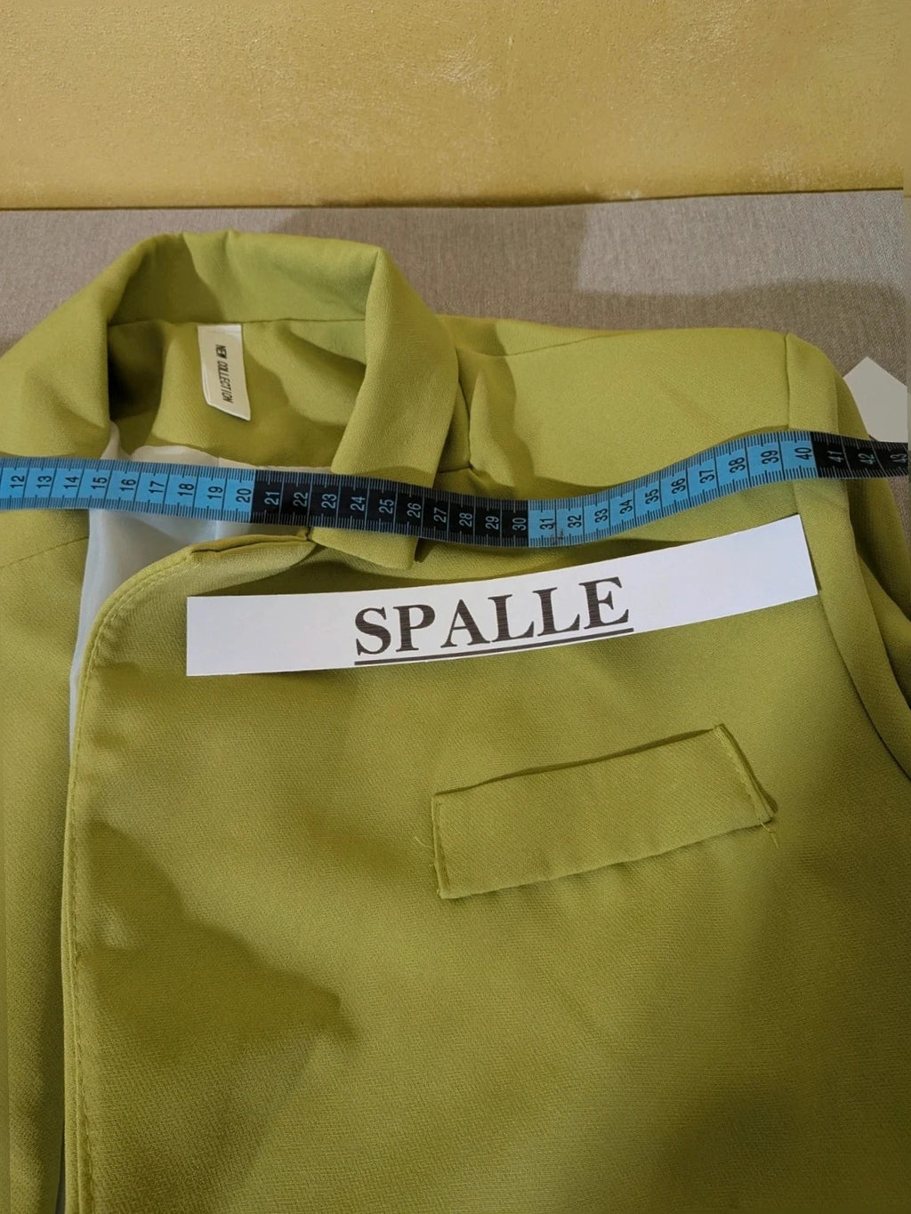 New Collection green suit set with fitted blazer, wide-leg trousers, and classic lapel details.