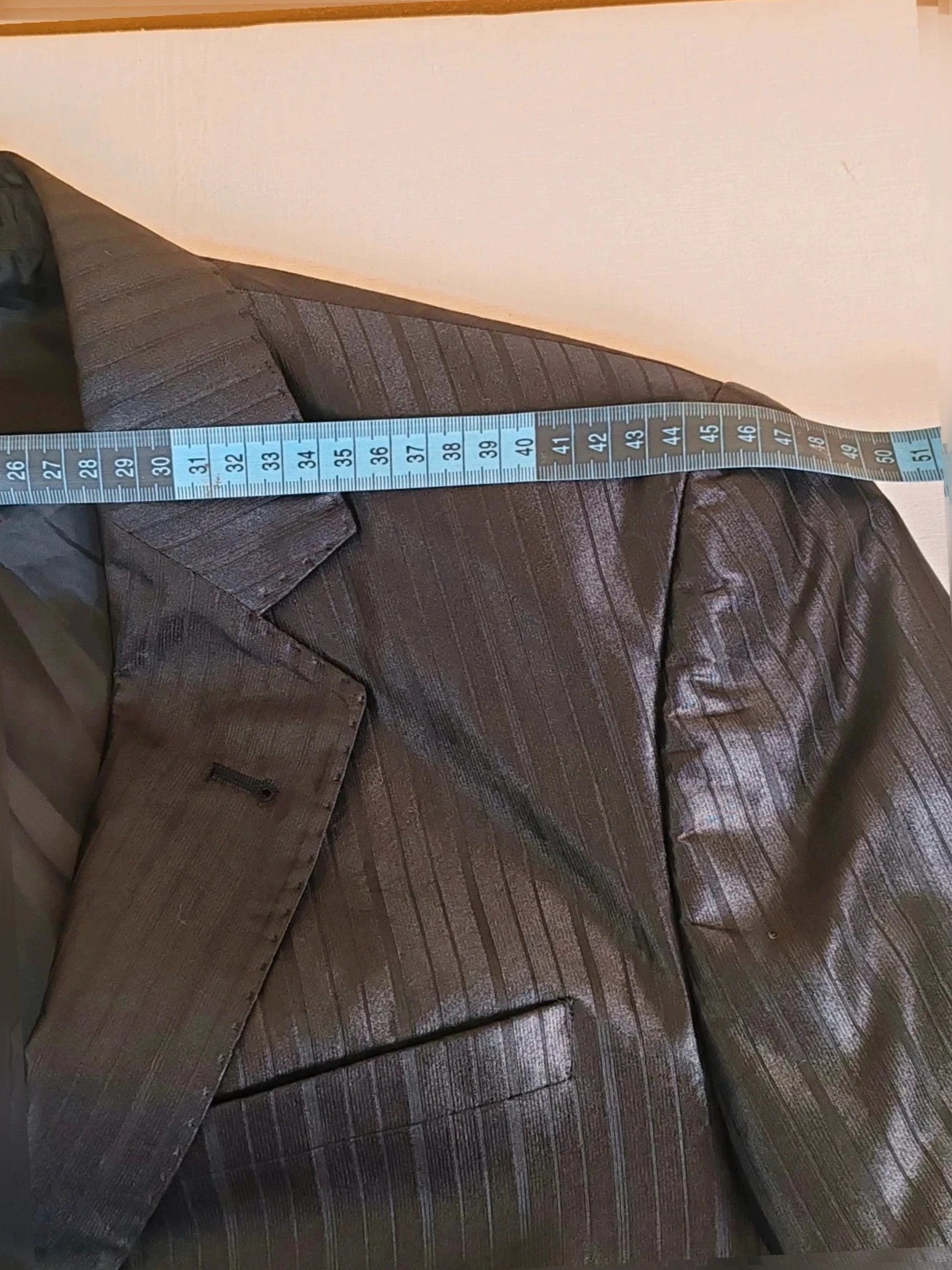 Bossano black suit jacket and trousers, pinstripe pattern, luxurious satin finish, new with tags.