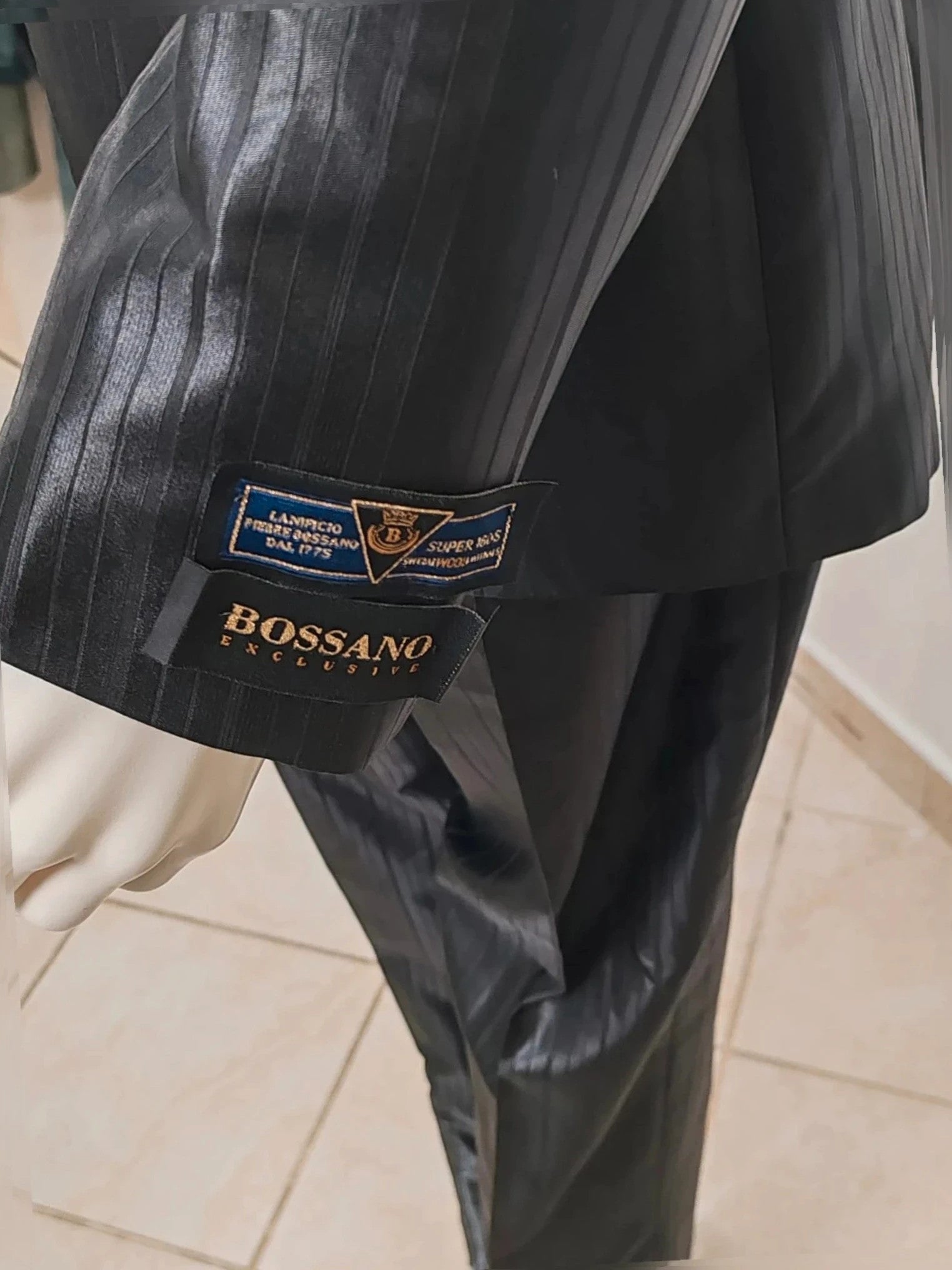 Bossano black suit jacket and trousers, pinstripe pattern, luxurious satin finish, new with tags.