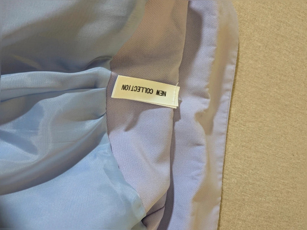 New Collection purple suit with modern blazer, classic lapels, and wide-leg trousers.