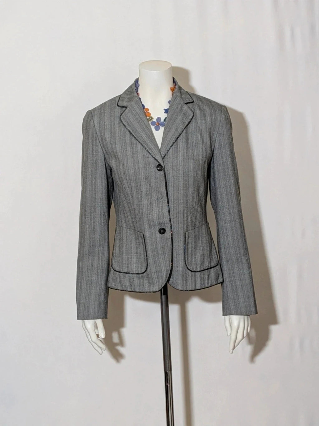Taifun grey pinstriped blazer with satin black trim and logo lining.