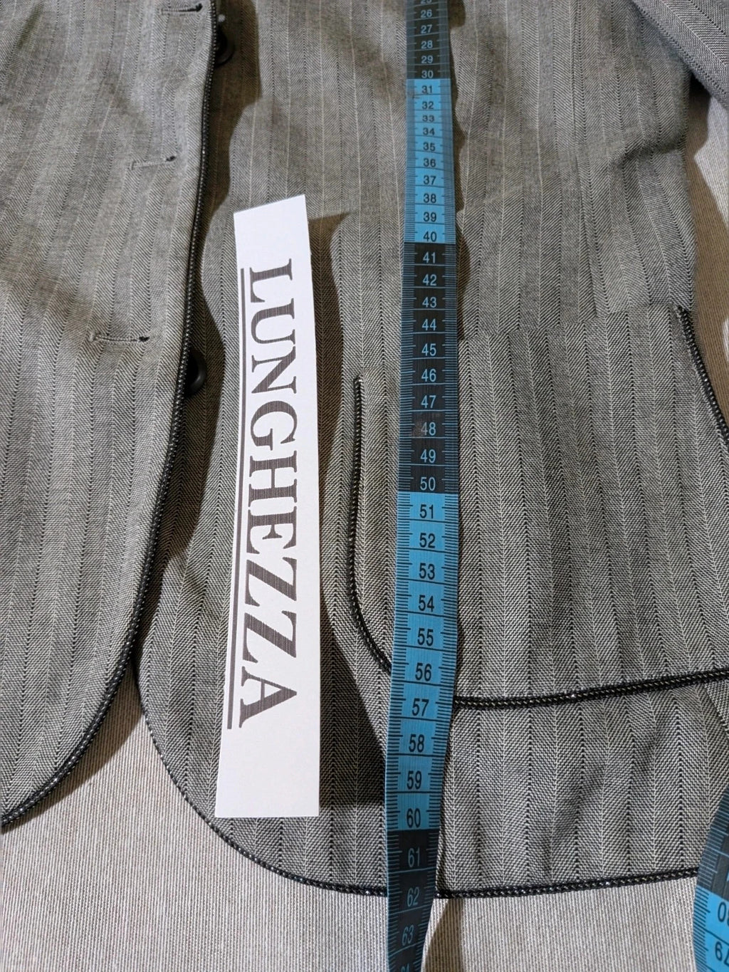 Taifun grey pinstriped blazer with satin black trim and logo lining.