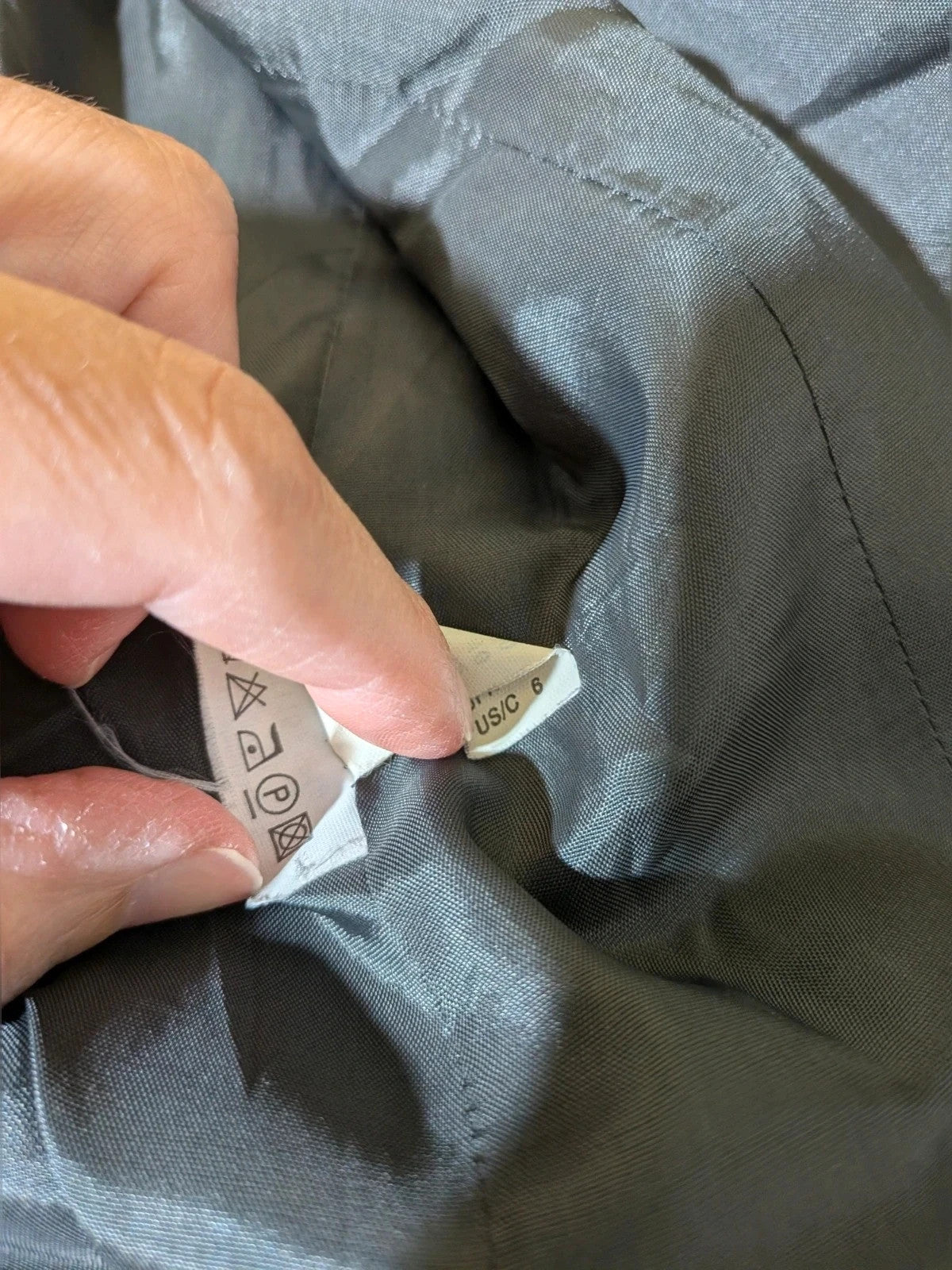 Taifun grey pinstriped blazer with satin black trim and logo lining.