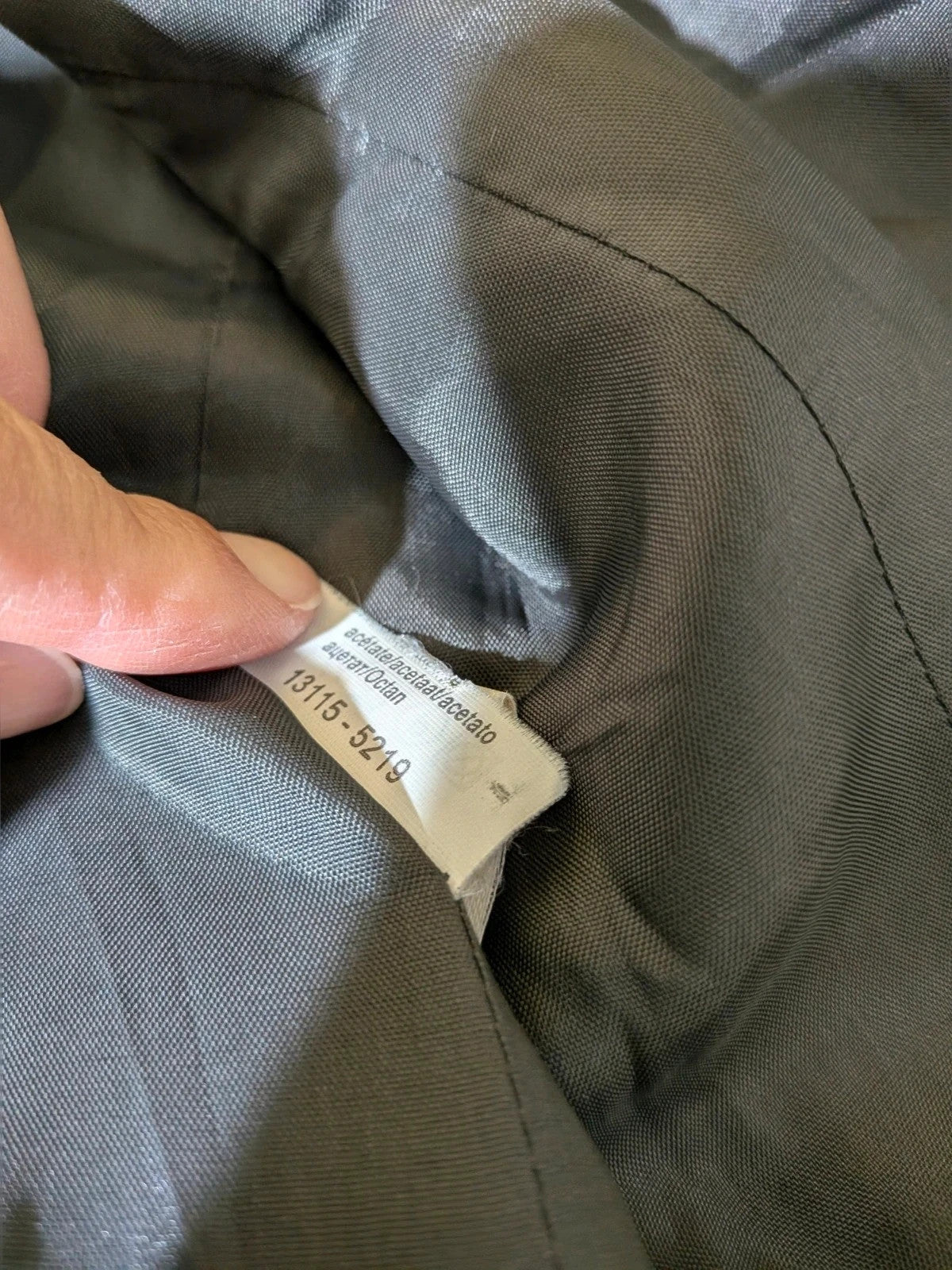 Taifun grey pinstriped blazer with satin black trim and logo lining.