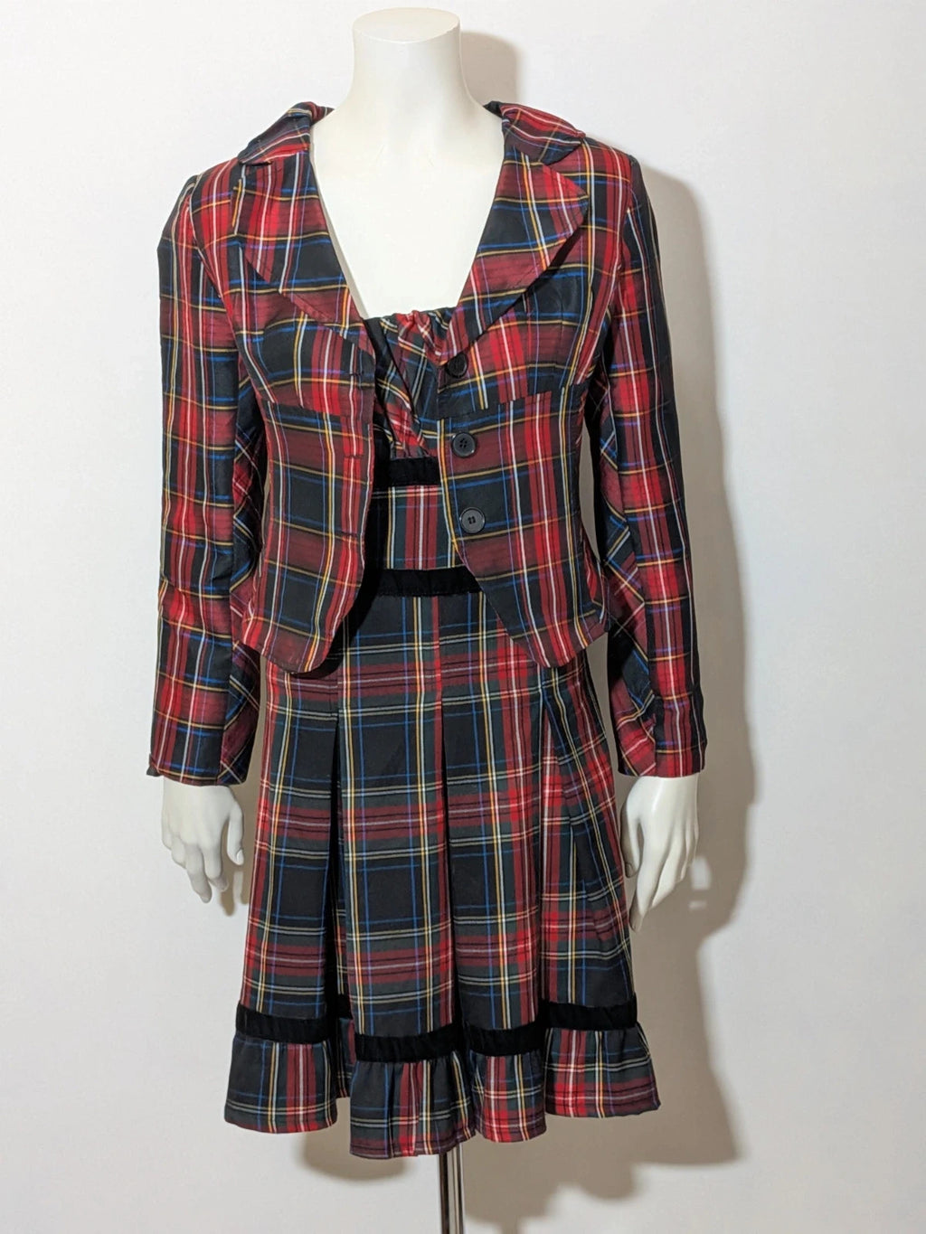 Made in Italy multi tartan skirt suit with black velvet details and structured bolero jacket.