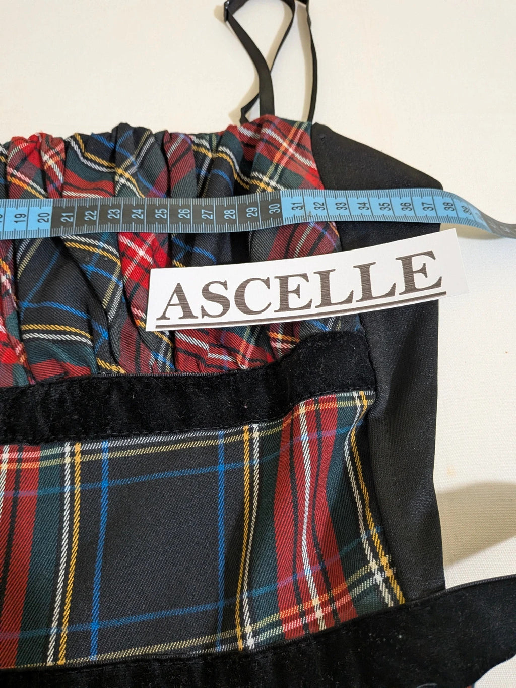 Made in Italy multi tartan skirt suit with black velvet details and structured bolero jacket.