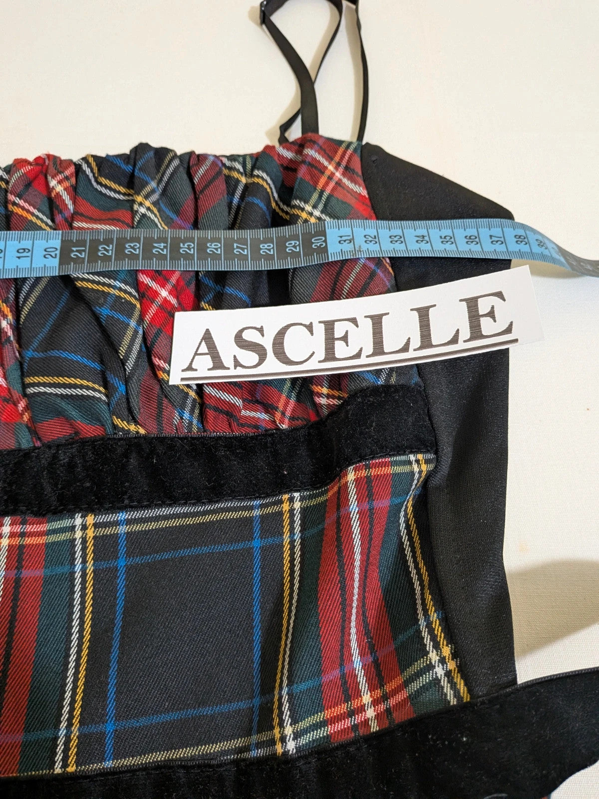 Made in Italy multi tartan skirt suit with black velvet details and structured bolero jacket.