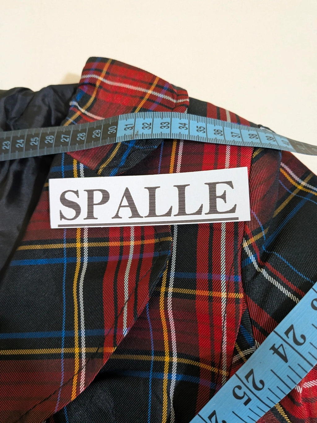Made in Italy multi tartan skirt suit with black velvet details and structured bolero jacket.
