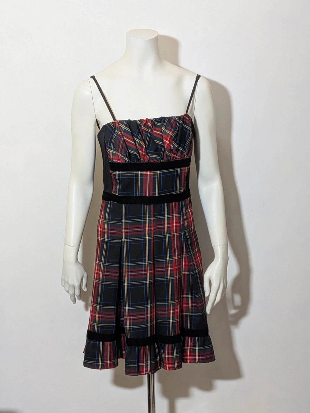 Made in Italy multi tartan skirt suit with black velvet details and structured bolero jacket.