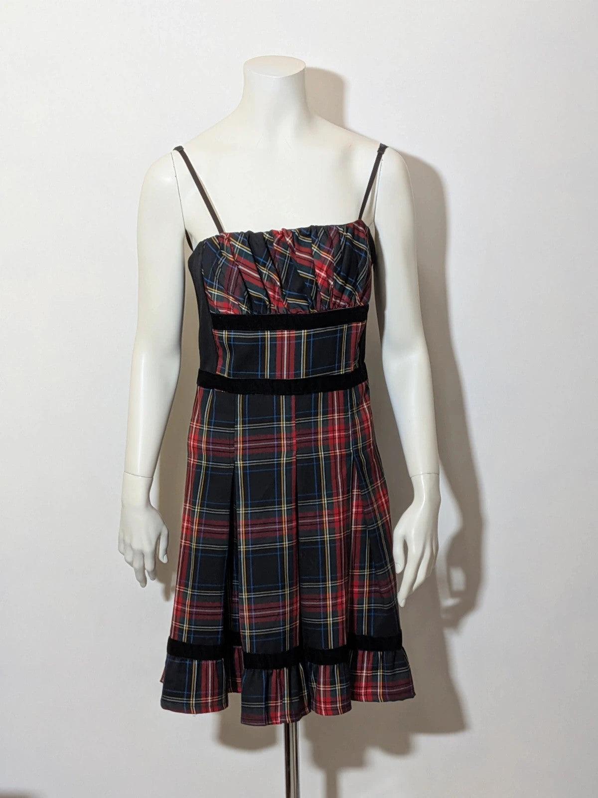 Made in Italy multi tartan skirt suit with black velvet details and structured bolero jacket.