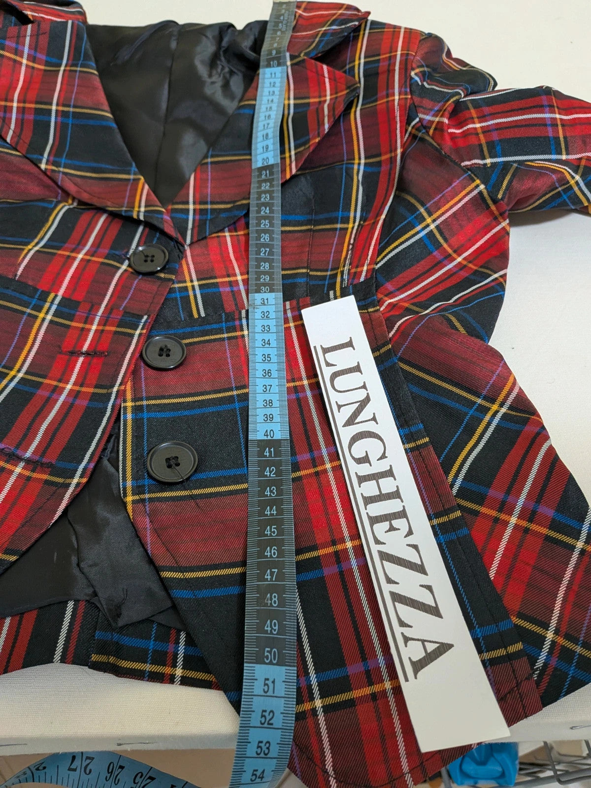 Made in Italy multi tartan skirt suit with black velvet details and structured bolero jacket.