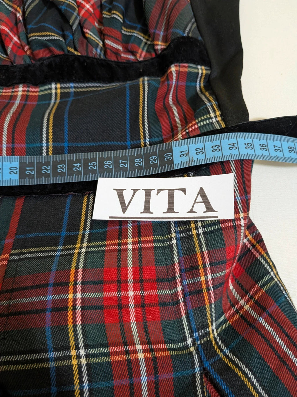 Made in Italy multi tartan skirt suit with black velvet details and structured bolero jacket.