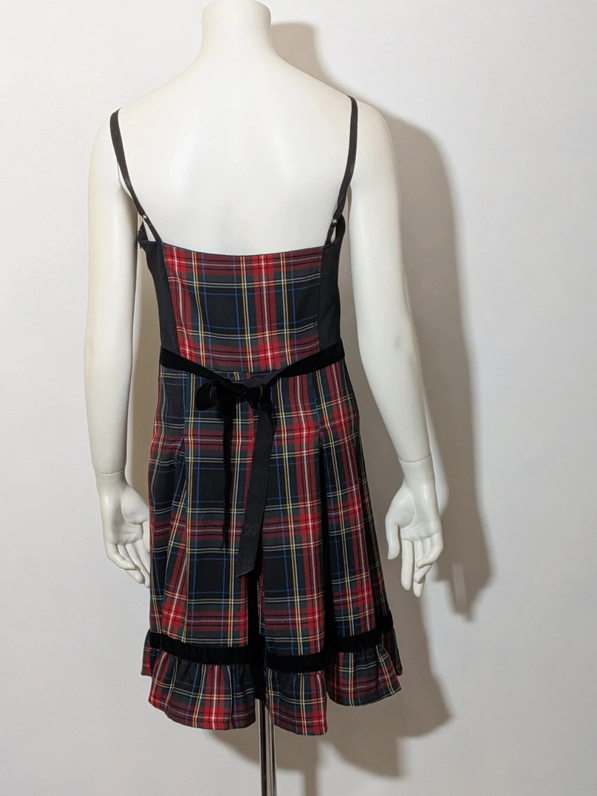 Made in Italy multi tartan skirt suit with black velvet details and structured bolero jacket.