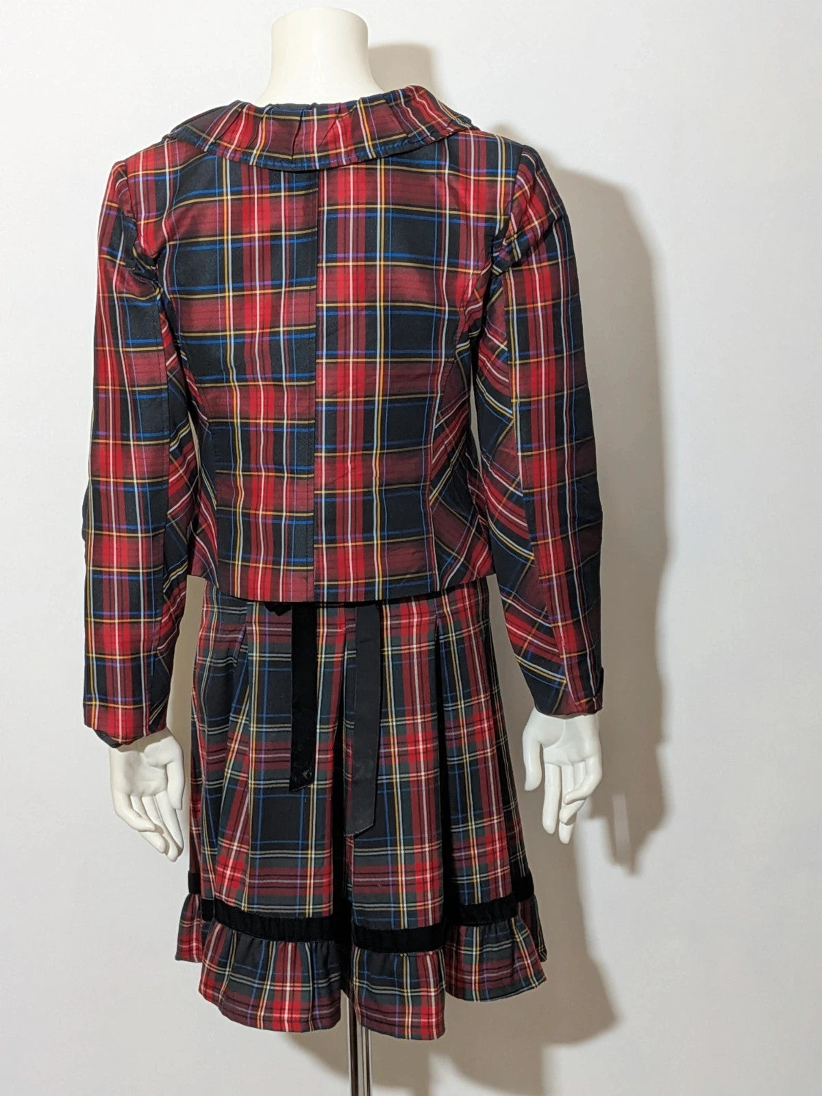 Made in Italy multi tartan skirt suit with black velvet details and structured bolero jacket.