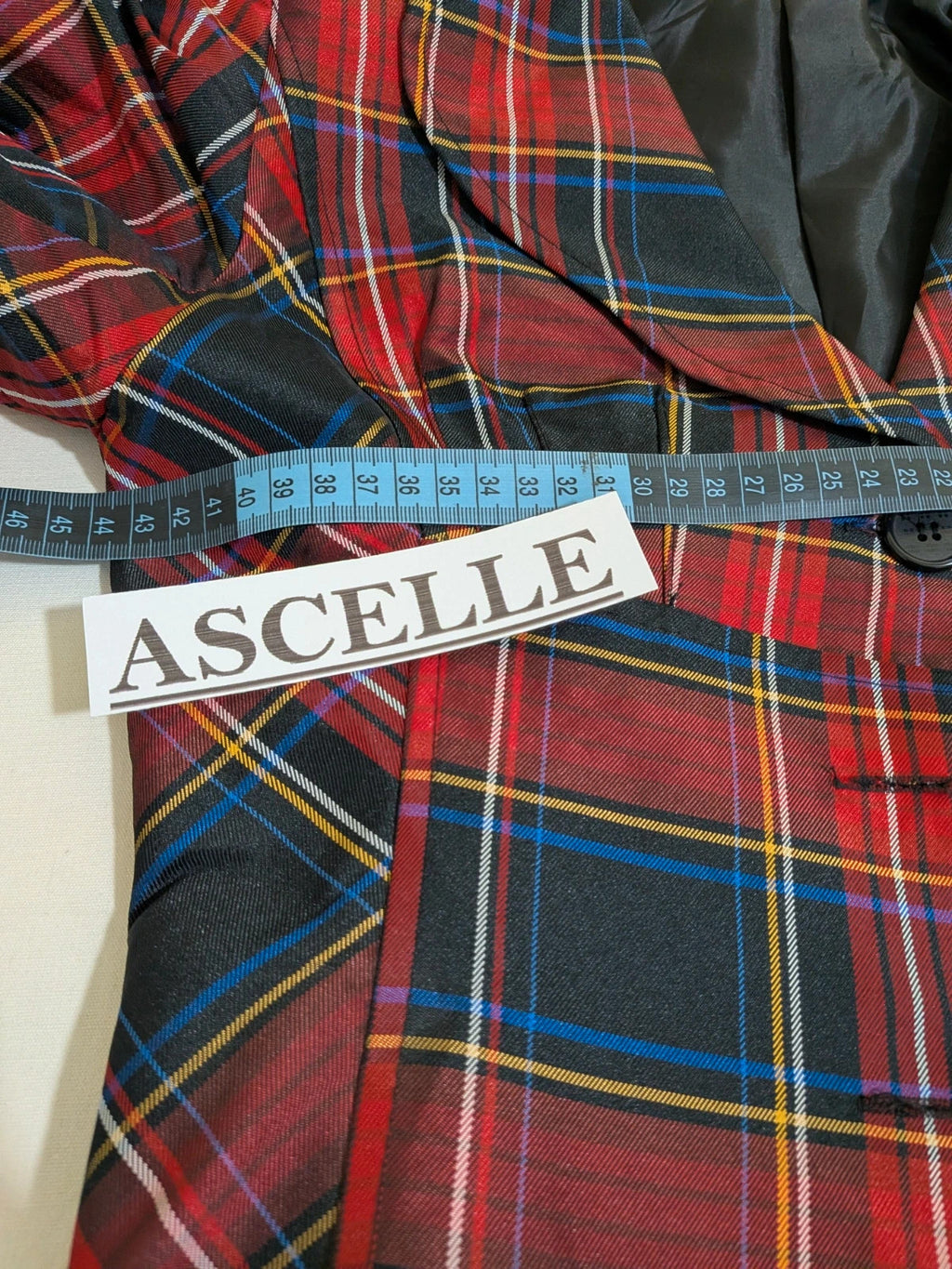 Made in Italy multi tartan skirt suit with black velvet details and structured bolero jacket.