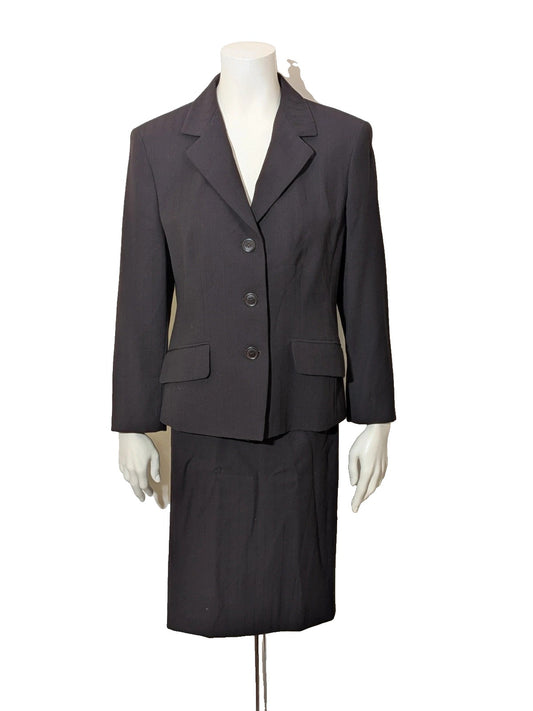 Retro brown skirt suit with structured jacket, subtle pinstripe pattern, and 100% virgin wool.