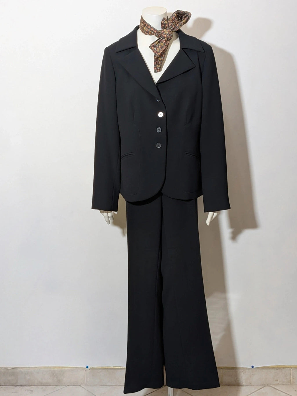 persona 21 black suit jacket and flared pants, 3-button closure, decorative pockets, polyester blend