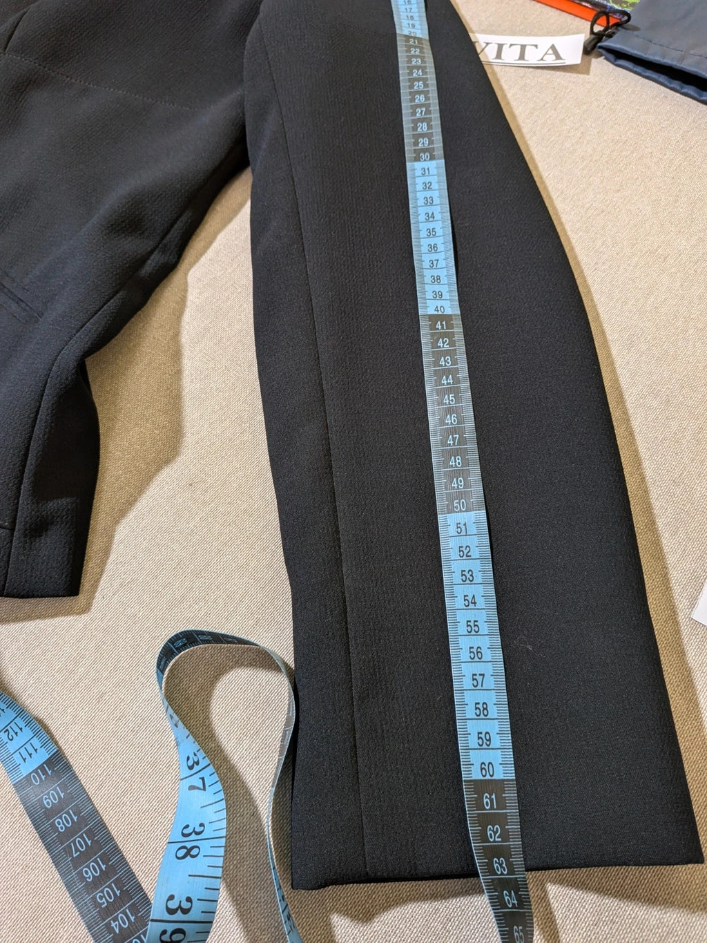 persona 21 black suit jacket and flared pants, 3-button closure, decorative pockets, polyester blend