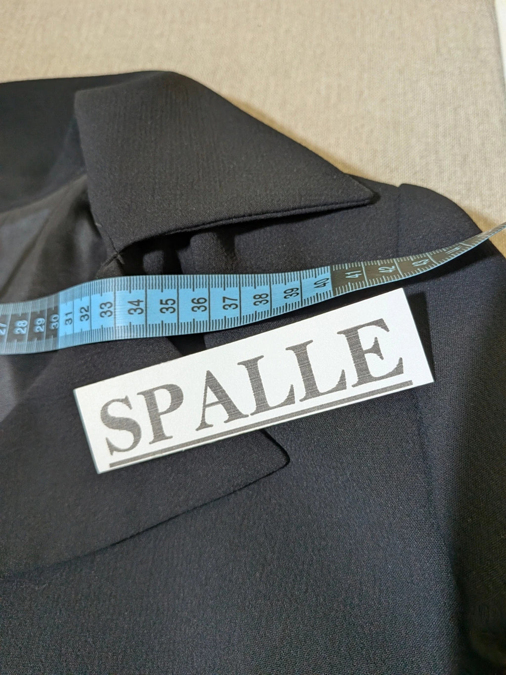 persona 21 black suit jacket and flared pants, 3-button closure, decorative pockets, polyester blend