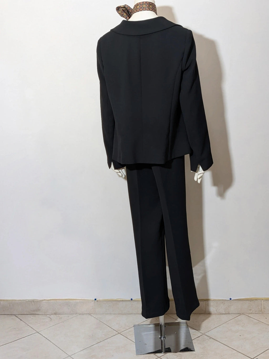 persona 21 black suit jacket and flared pants, 3-button closure, decorative pockets, polyester blend