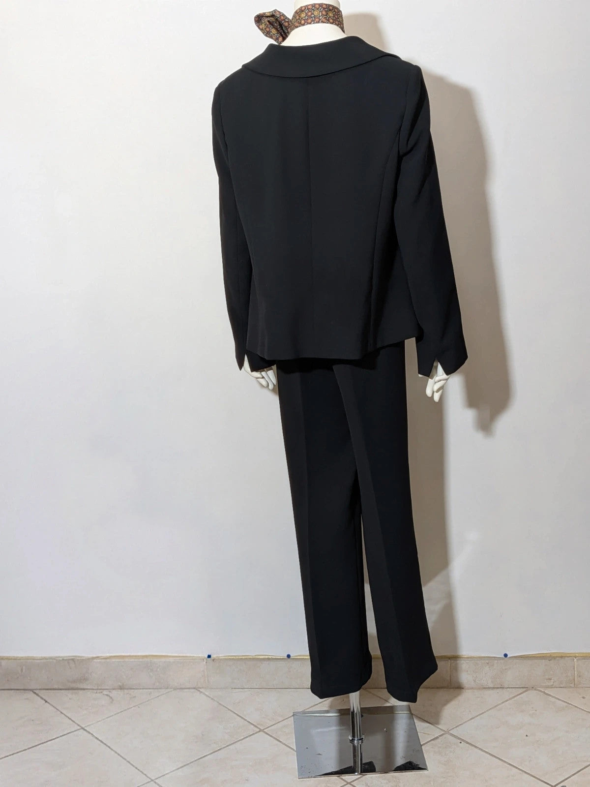 persona 21 black suit jacket and flared pants, 3-button closure, decorative pockets, polyester blend