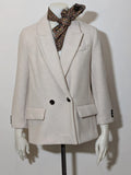 OVS beige double-breasted blazer with dark button closure and classic lapels.