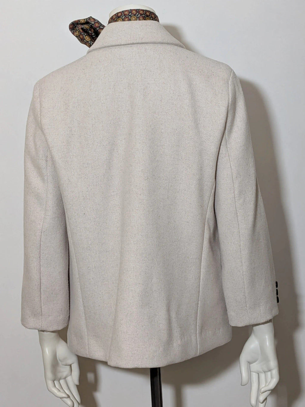 OVS beige double-breasted blazer with dark button closure and classic lapels.