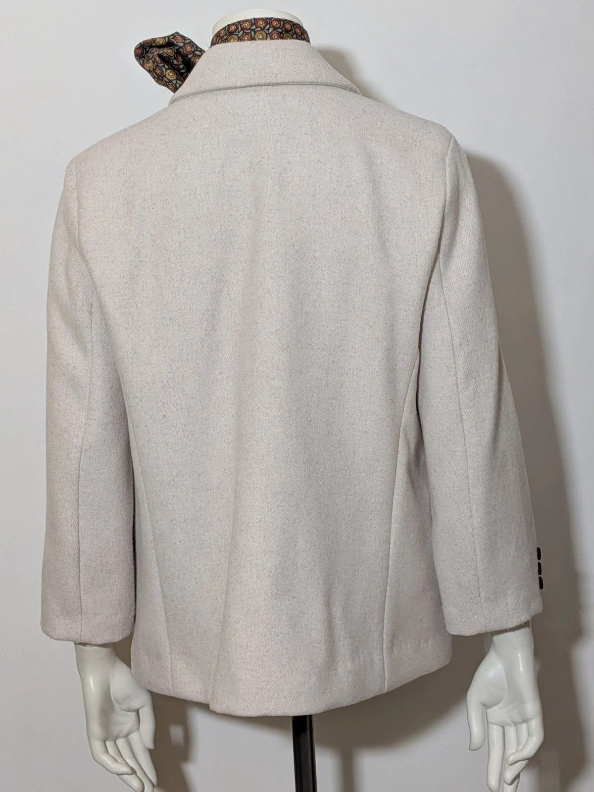 OVS beige double-breasted blazer with dark button closure and classic lapels.