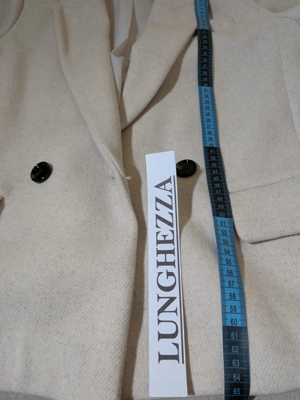 OVS beige double-breasted blazer with dark button closure and classic lapels.