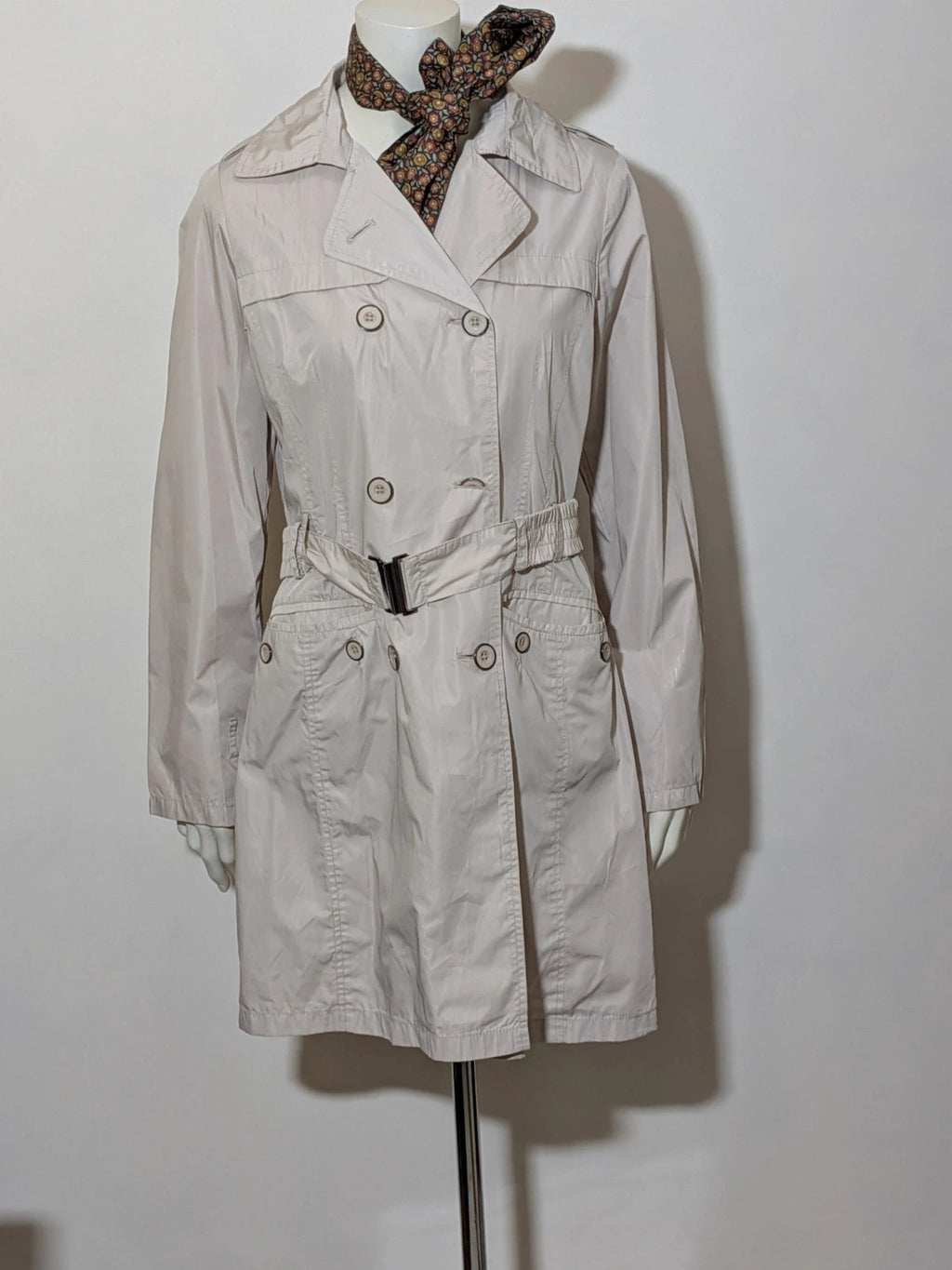 Maps Girl beige trench coat lightweight double-breasted buttons, structured shoulders, adjustable waist belt.