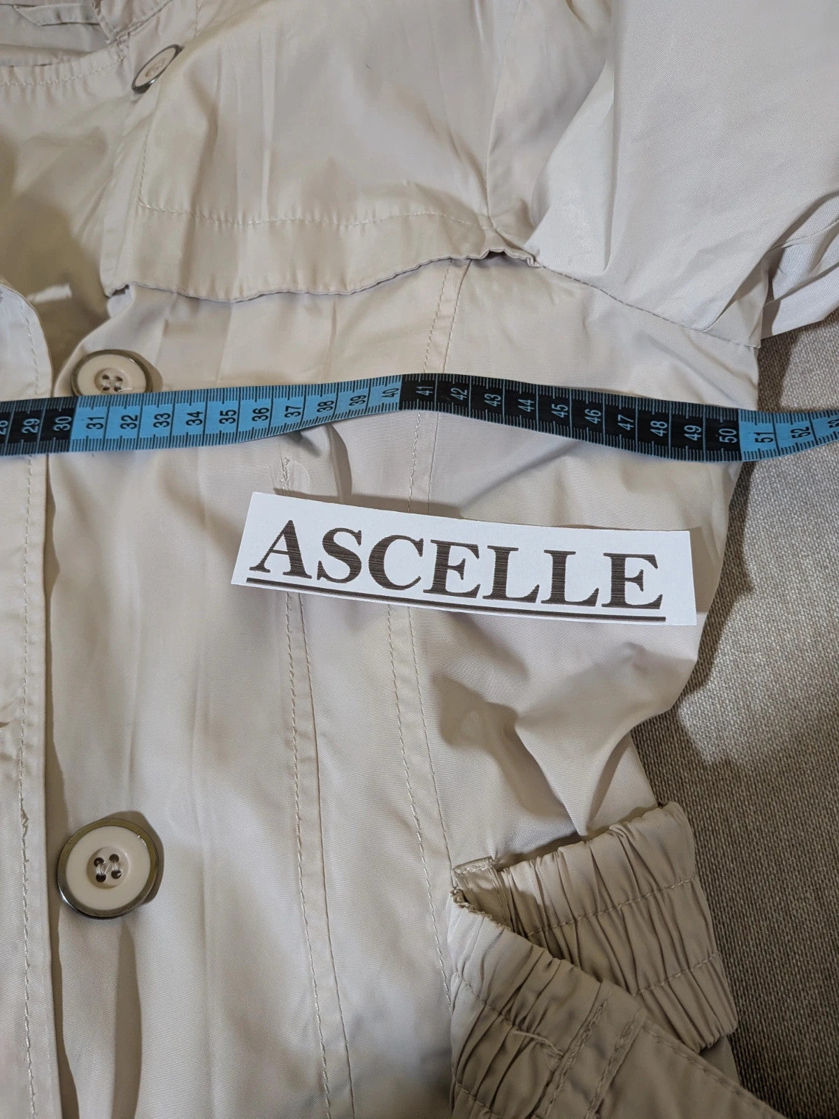 Maps Girl beige trench coat lightweight double-breasted buttons, structured shoulders, adjustable waist belt.
