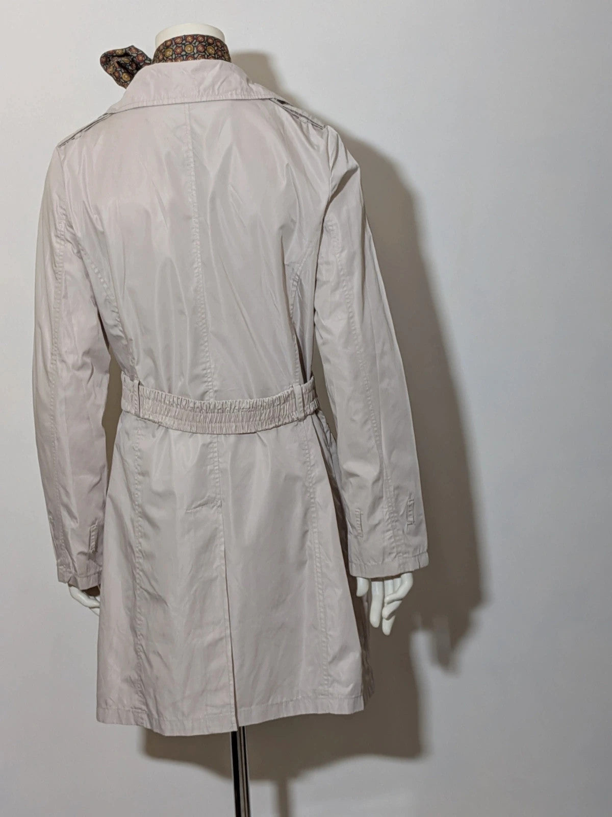 Maps Girl beige trench coat lightweight double-breasted buttons, structured shoulders, adjustable waist belt.