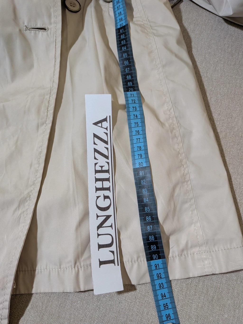 Maps Girl beige trench coat lightweight double-breasted buttons, structured shoulders, adjustable waist belt.