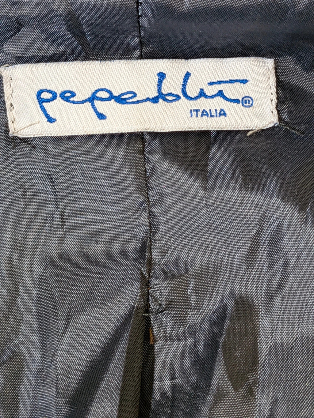Pepe navy trench coat with double-breasted buttons, belted waist, and structured shoulders.