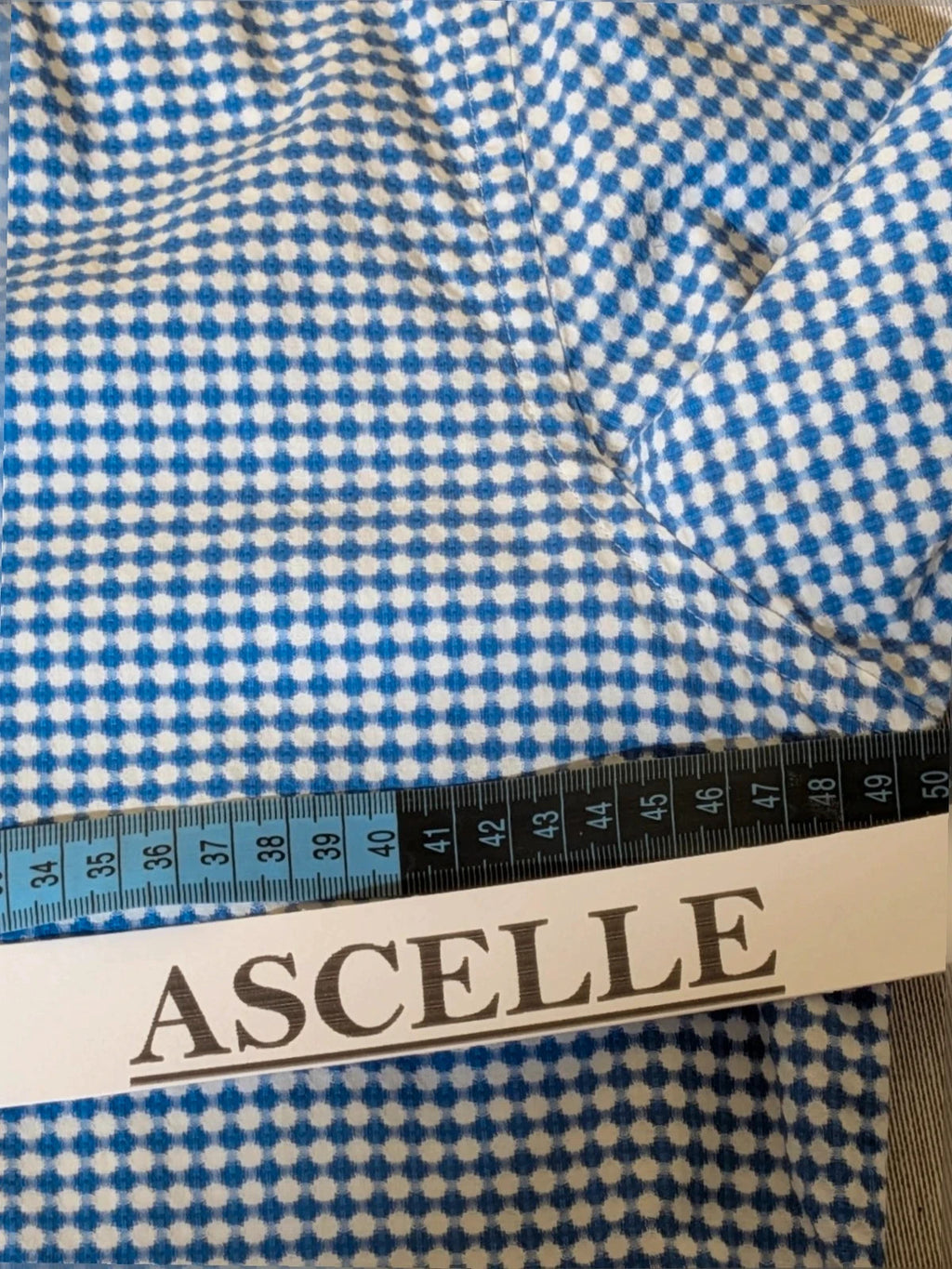 INVIDIA blue and white micro-check shirt with contrasting red collar tape and dark buttons.