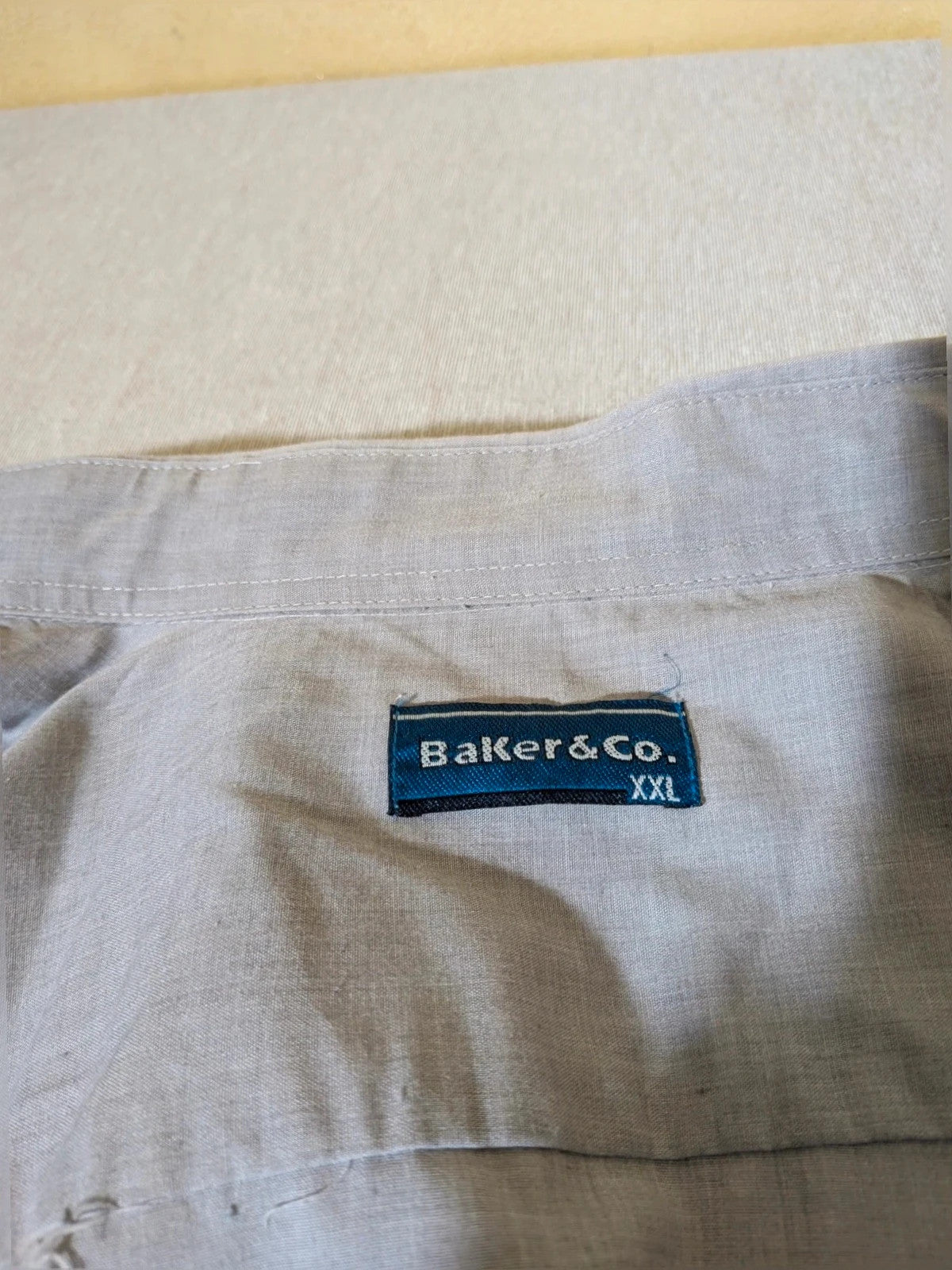 Baker grey men's shirt with subtle design details, perfect for versatile styling.