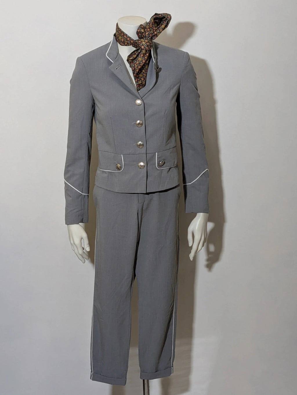 Imperial grey suit with white piping and jewel buttons, elegant fitted blazer and pants.