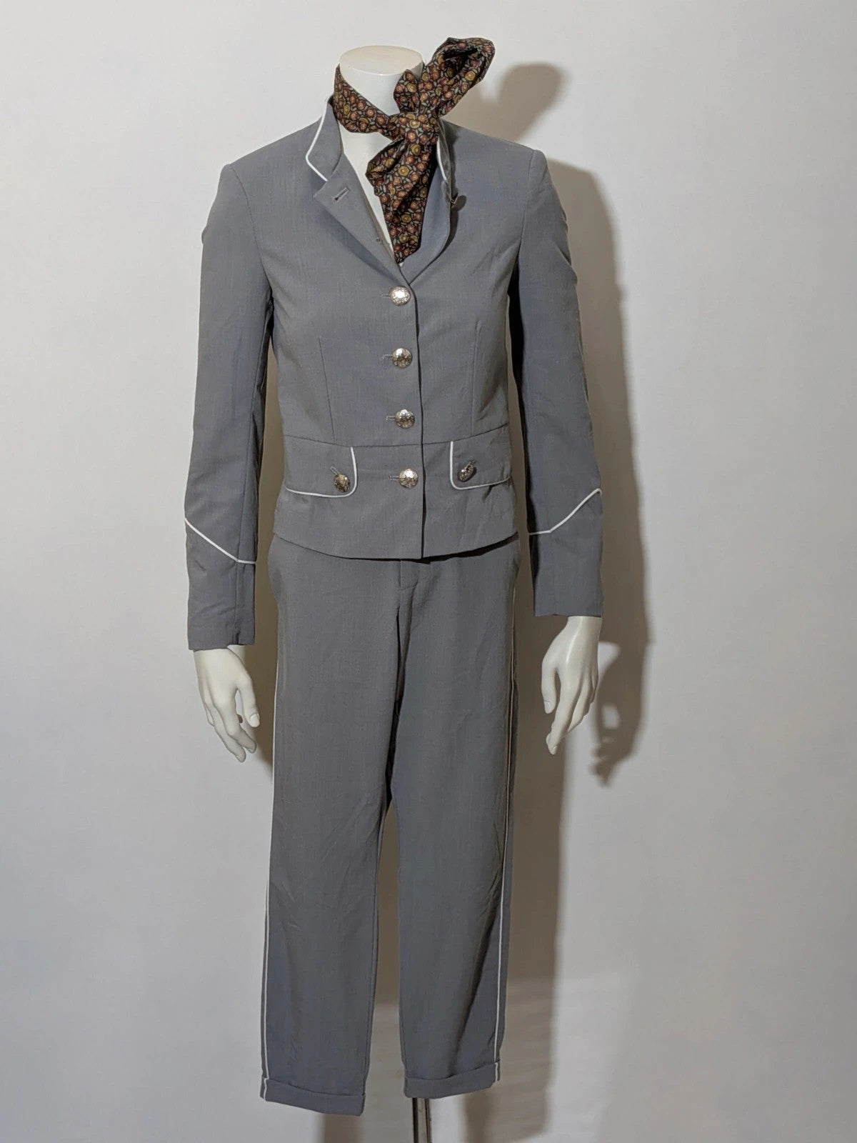 Imperial grey suit with white piping and jewel buttons, elegant fitted blazer and pants.