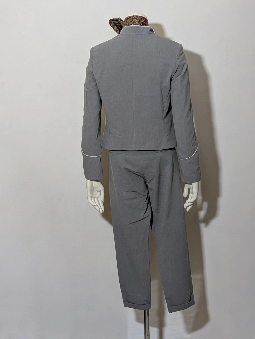 Imperial grey suit with white piping and jewel buttons, elegant fitted blazer and pants.