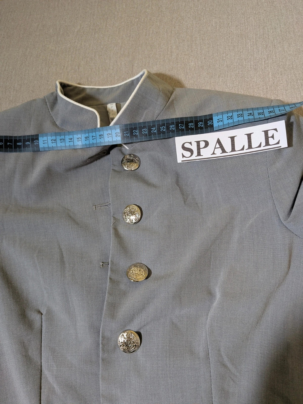 Imperial grey suit with white piping and jewel buttons, elegant fitted blazer and pants.