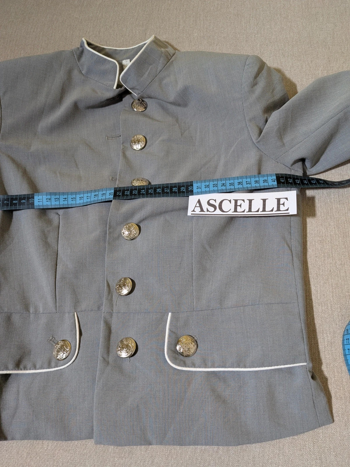 Imperial grey suit with white piping and jewel buttons, elegant fitted blazer and pants.