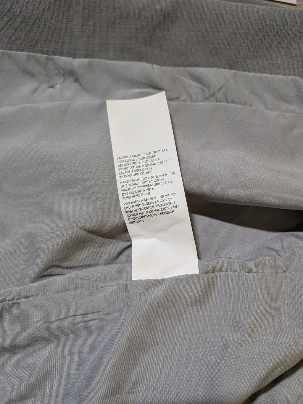 Imperial grey suit with white piping and jewel buttons, elegant fitted blazer and pants.