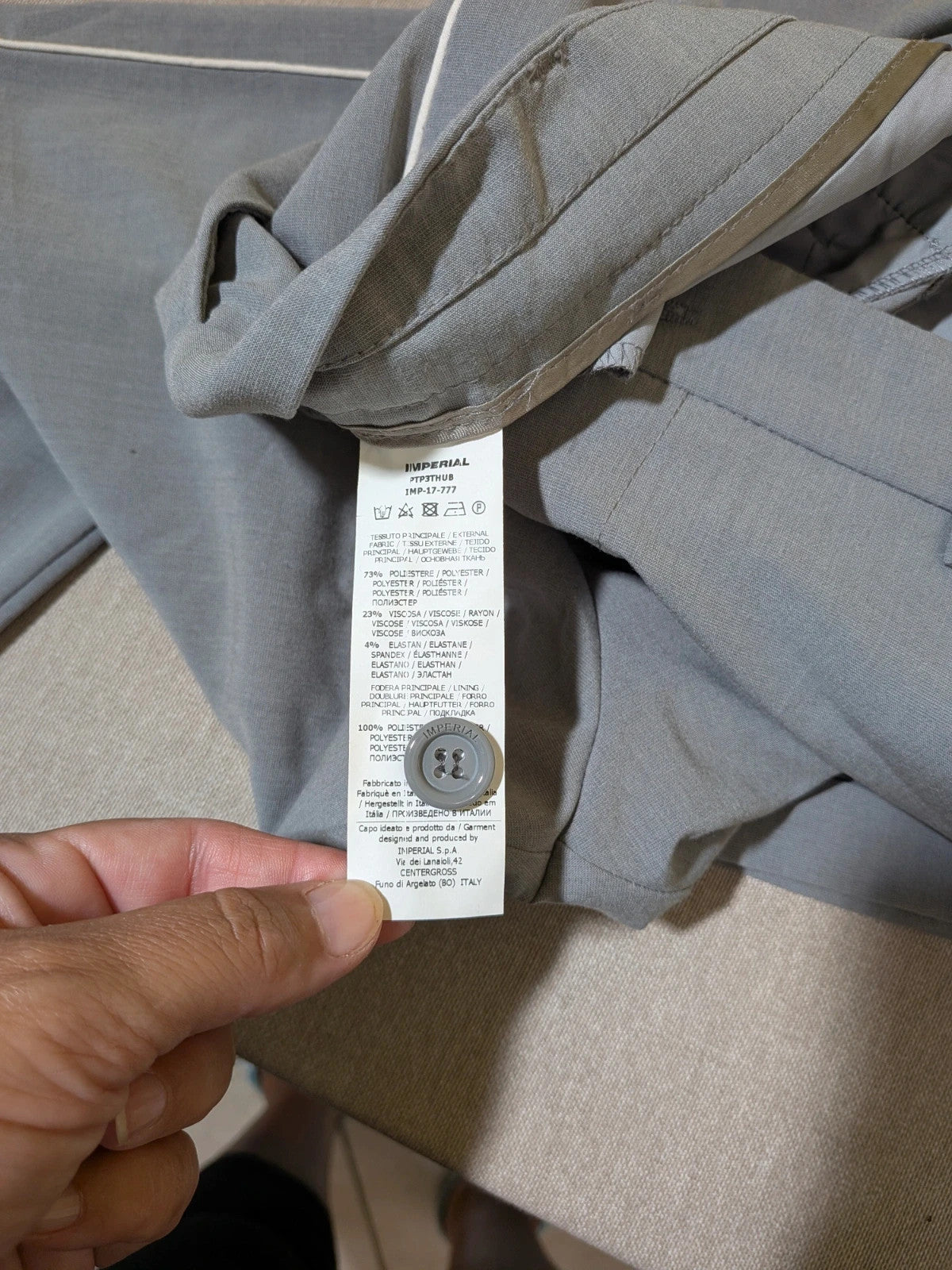 Imperial grey suit with white piping and jewel buttons, elegant fitted blazer and pants.
