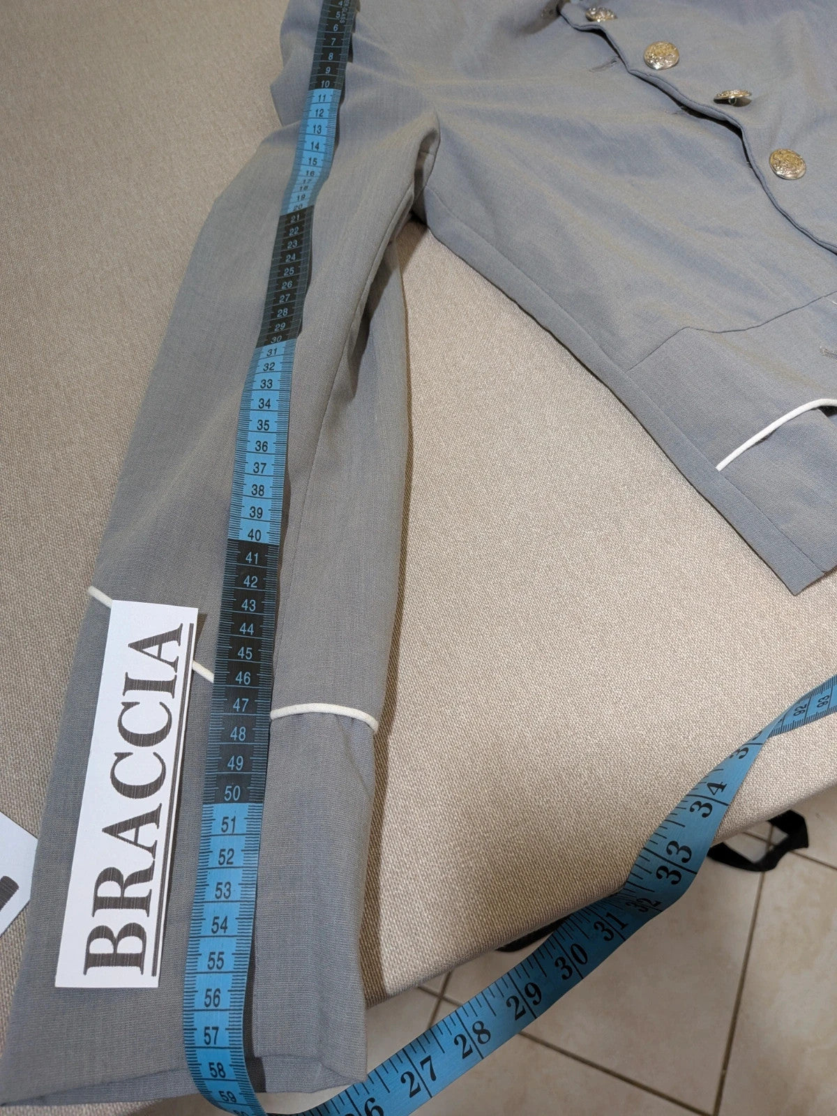 Imperial grey suit with white piping and jewel buttons, elegant fitted blazer and pants.