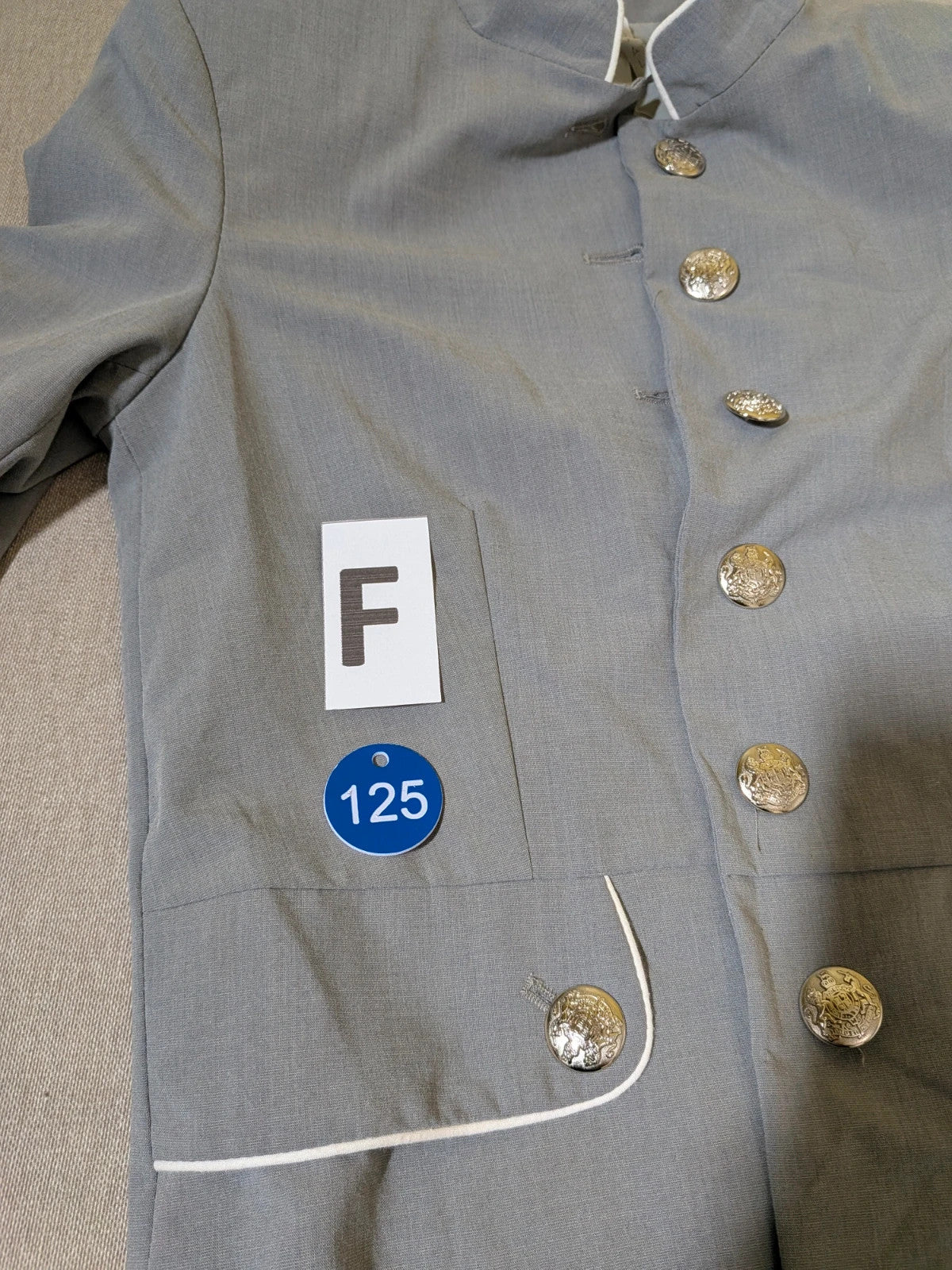 Imperial grey suit with white piping and jewel buttons, elegant fitted blazer and pants.