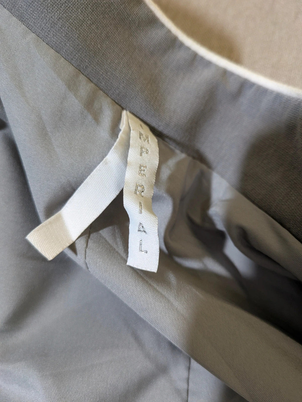 Imperial grey suit with white piping and jewel buttons, elegant fitted blazer and pants.
